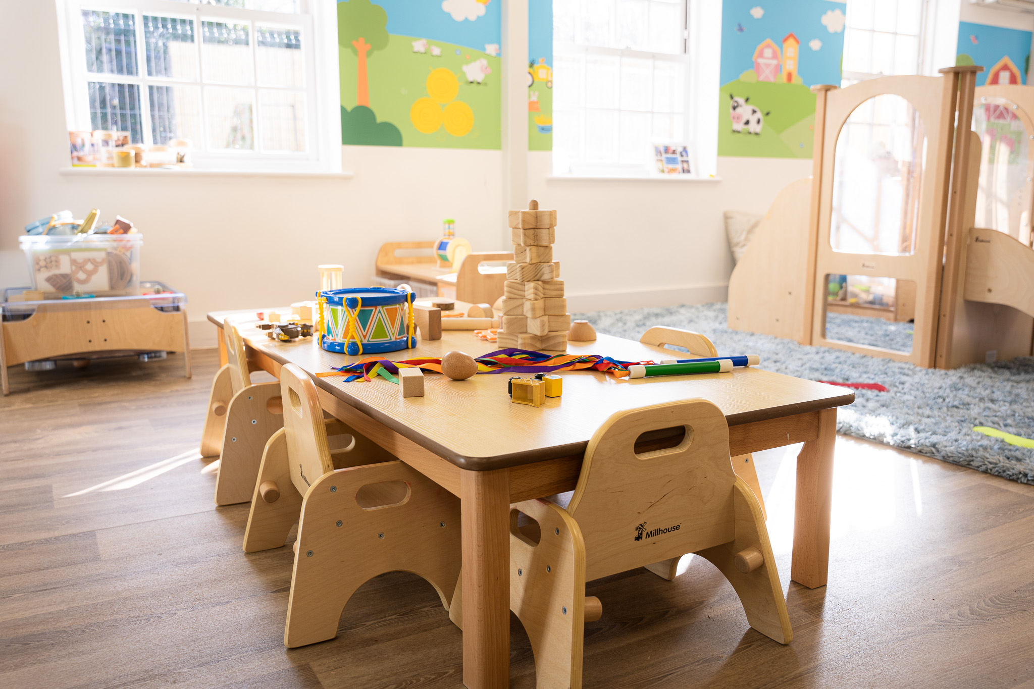 wooden table, chairs and toys